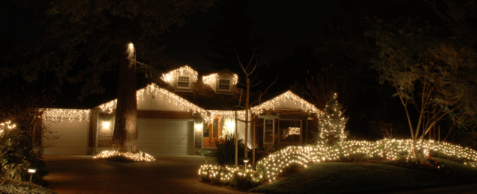 House decorated with holiday lights, showcasing energy-efficient solutions for festive lighting with Sunergy Systems.